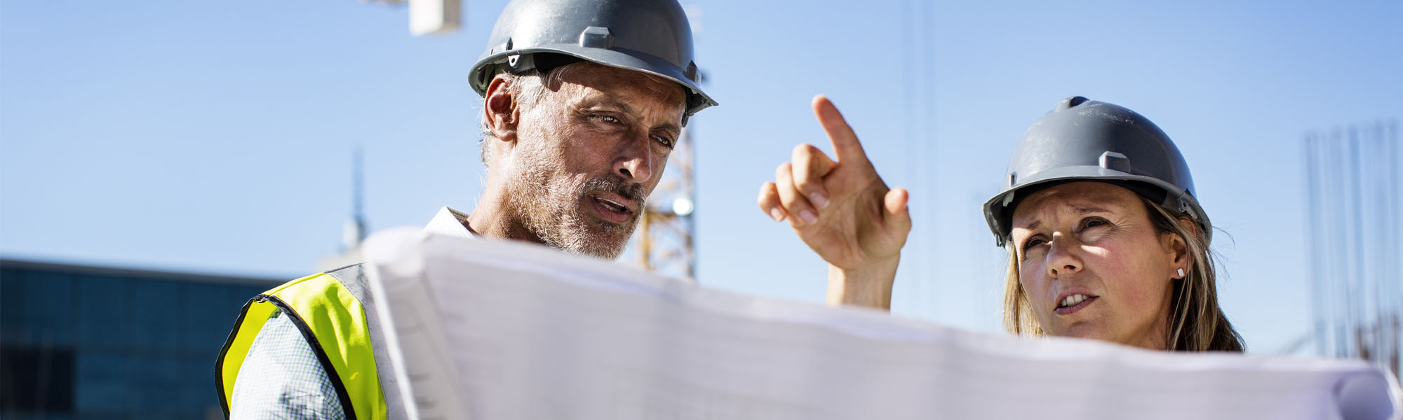 two engineers looking at construction plans