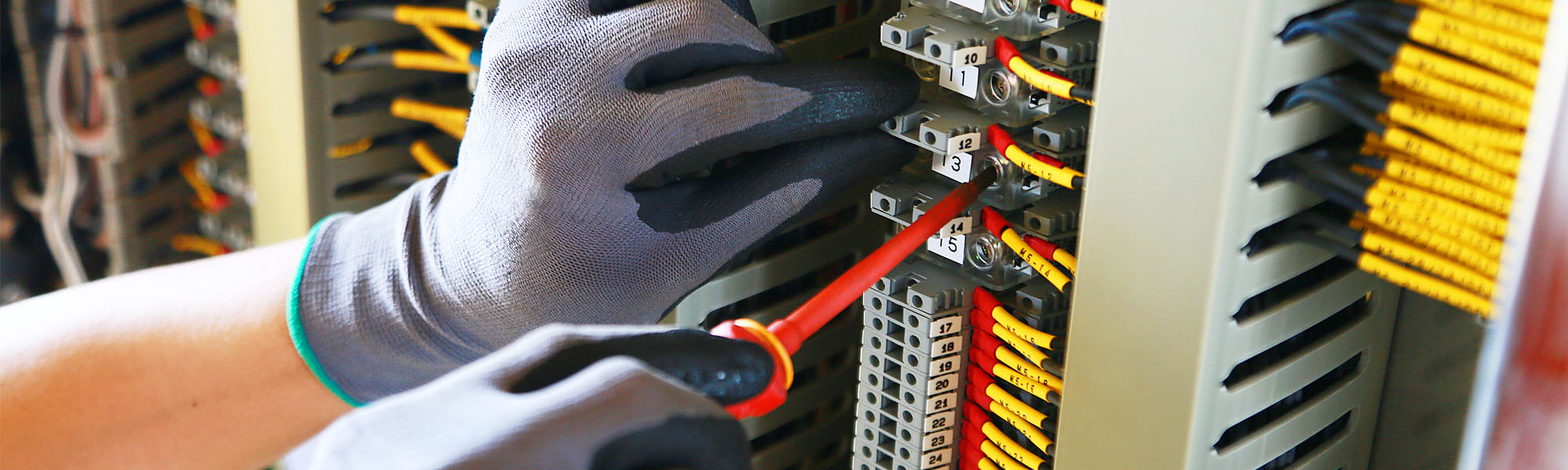 Engineer installing electrical panel