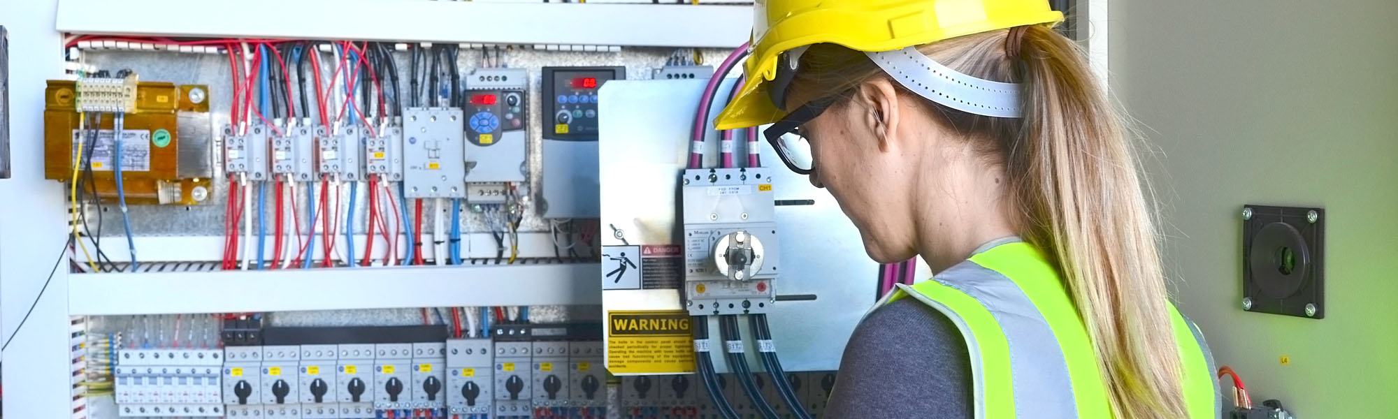 Female worker inspection electric panel