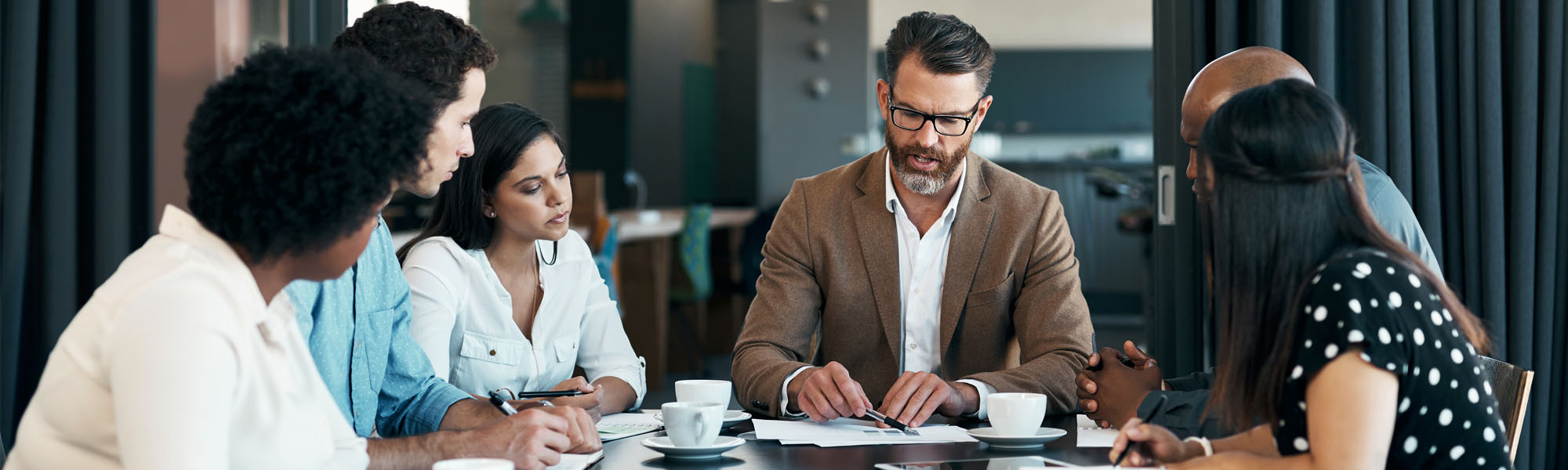 Project managers sitting around a table