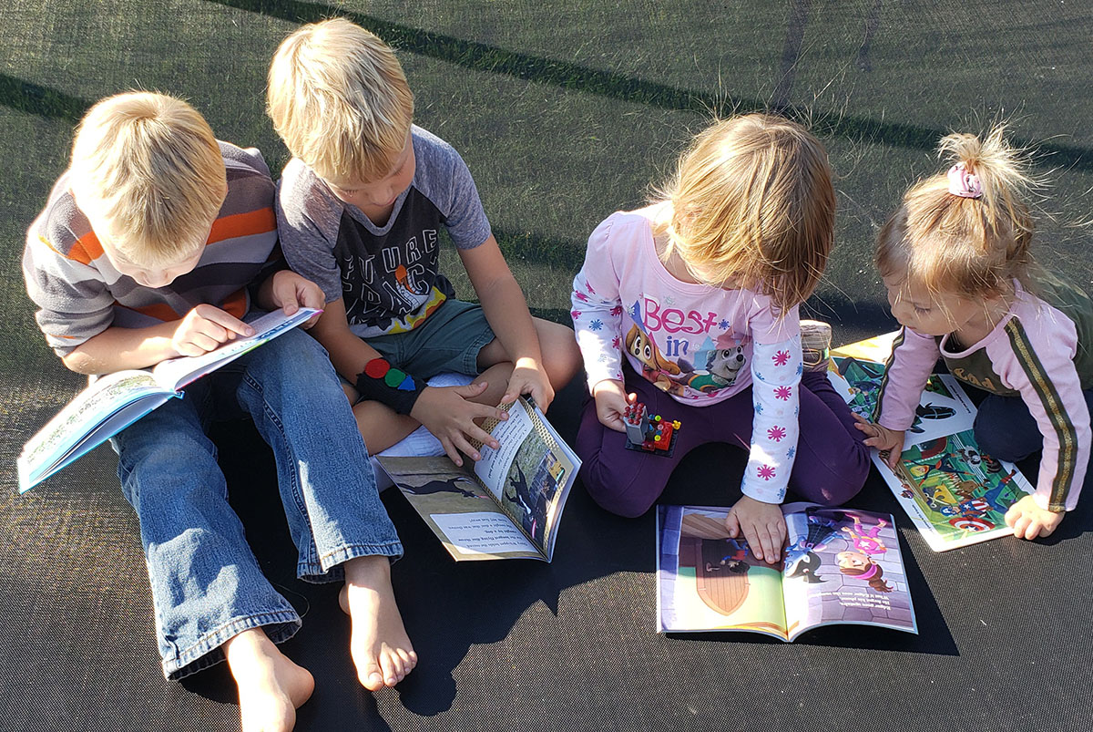 Read Aloud Family checking out books we sent them