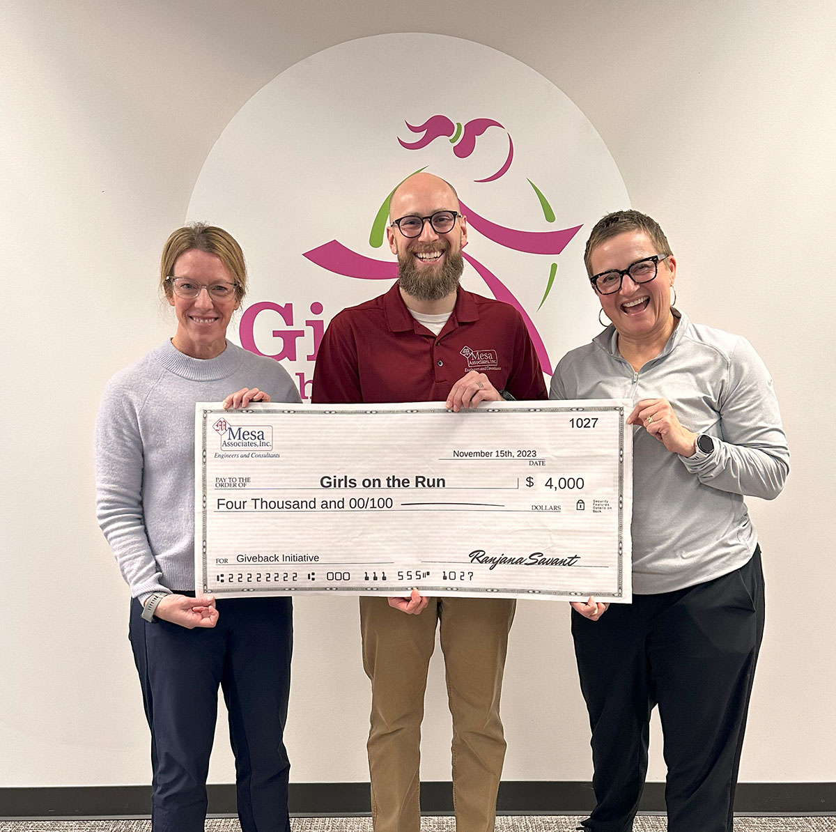 Rob Shirey (PDT) delivering a check to Girls On the Run in Kansas City 