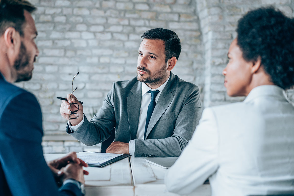 Group of business persons talking in the office